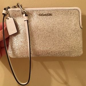 Silver and white Coach wristlet