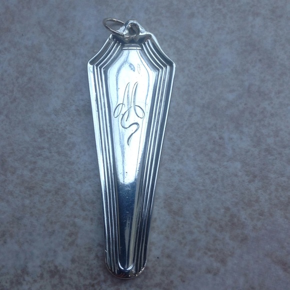 "M" monogrammed pendant. Swirled