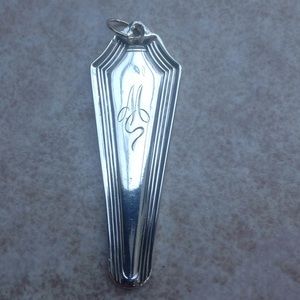 "M" monogrammed pendant. Swirled