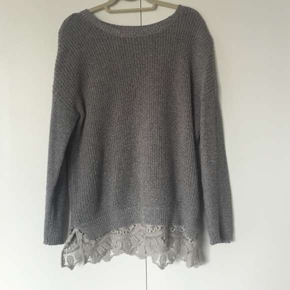 Gray sweater with lace detailing on the bottom