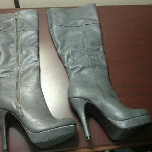 Bought and never wore. High heel knee boots.