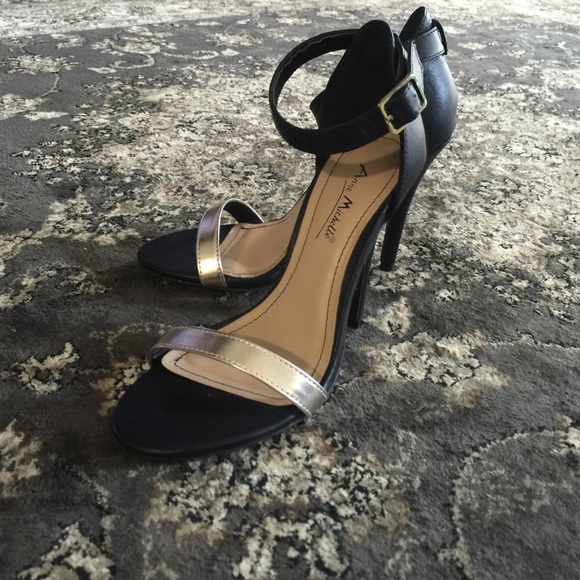 Black and gold strappy heels