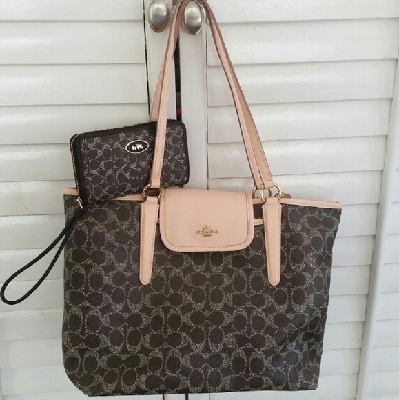 HOLDING Coach handbag and wrislet