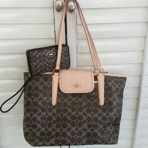HOLDING Coach handbag and wrislet