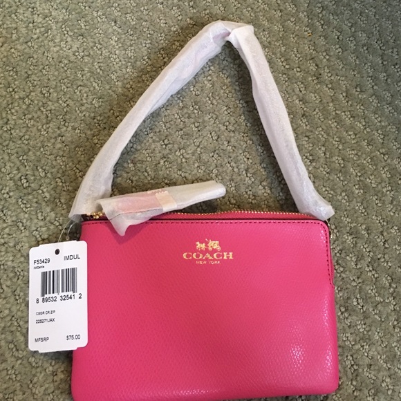 Super cute hot pink wristlet by coach!