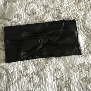 Black bow clutch purse
