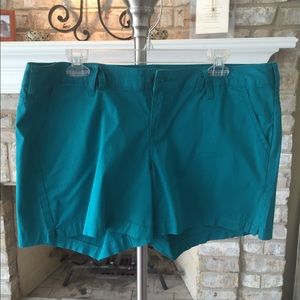 Green/teal shorts. Never been worn.