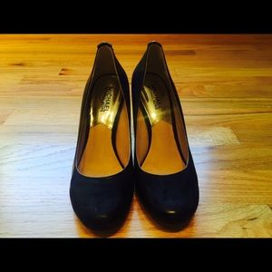 Michael Kors patent leather classic heels.