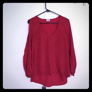 Red blouse with butterfly sleeves.