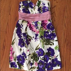 Knee length floral, strapless dress.