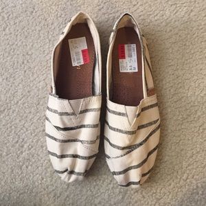 Black and white striped slip on shoes
