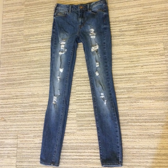 high waisted destroyed jeans