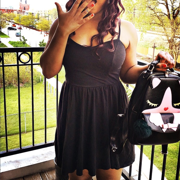 Lush, black skater dress with adjustable straps.