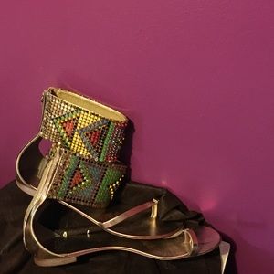 These are a very unique pair of Giuseppe sandals.