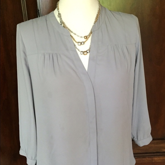 Light weight, lite taupe/grayish color, shirt.