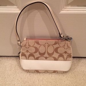 Coach wristlet. Signature and cream.