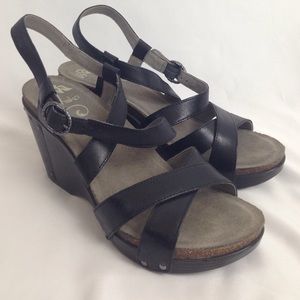 Super cute never worn black wedge sandal.