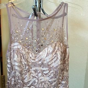 A beautiful  dress used once for a wedding.