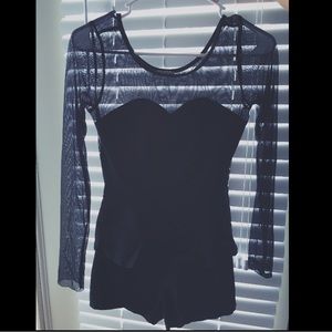 Sheer and black peplum romper