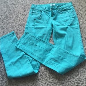 Teal distressed skinny jeans