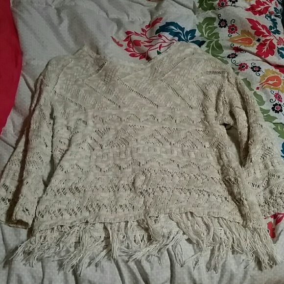 Off white, half sleeved, fringed at the bottom