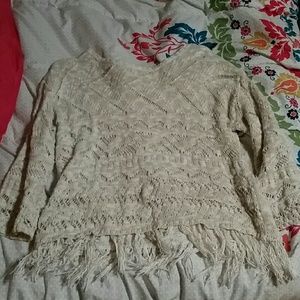 Off white, half sleeved, fringed at the bottom