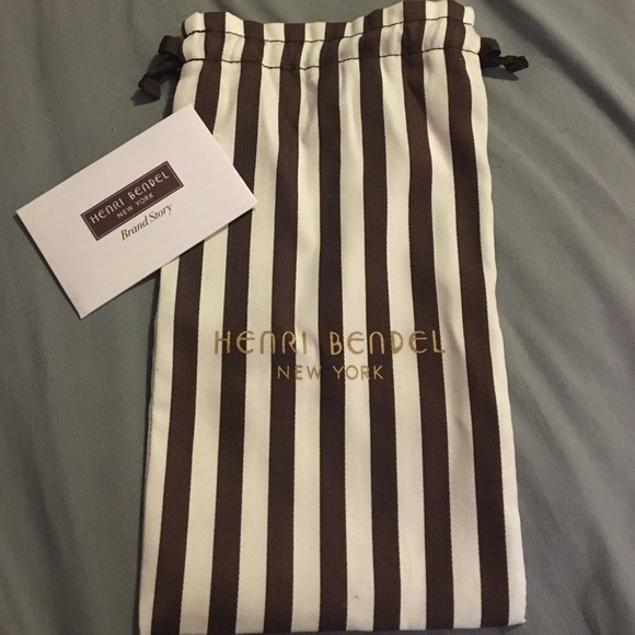 Wallet size drawstring canvas bag. HENRI BENDEL