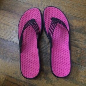 Pink nike flip flops