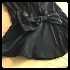 Black peplum top with open back and bow!