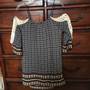 Stylish blouse with crocheted sleeve.