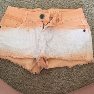 Orange and white flowered shorts