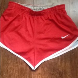 Red Nike athletic shorts