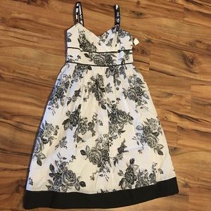 White dress with black floral design