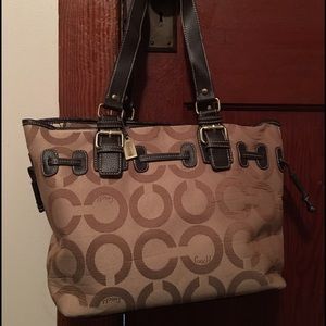 Large gently used coach purse with many pockets.