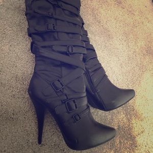 Belted high heeled boots with zipper up to calf.