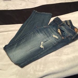 American Eagle kick boot jeans with holes.