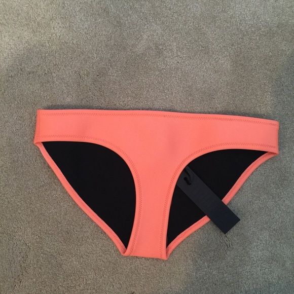Brand new. Never worn. Triangle Tilly bottom