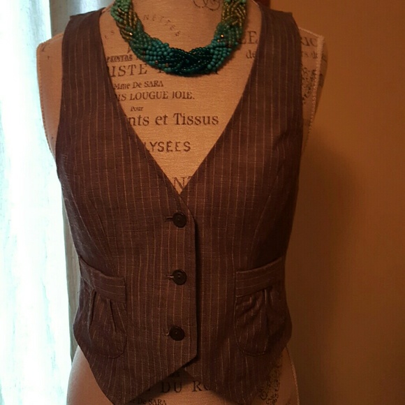 A warm gray with white pin striping Vest