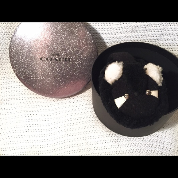 COACH raccoon ear muffs.