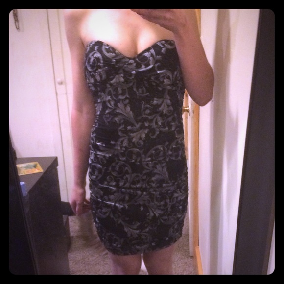 Form fitting strapless scrunch dress