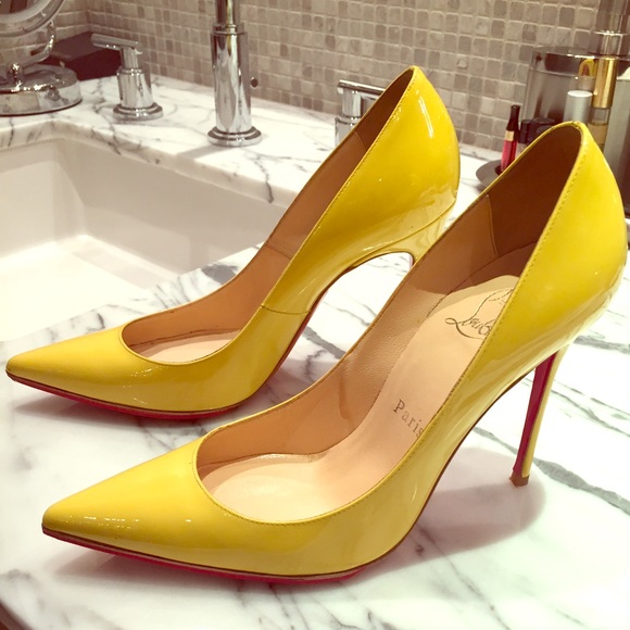 Christian Louboutin yellow pointy pumps. Size 6.