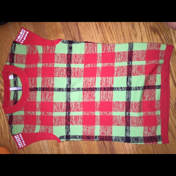 plaid sweater vest with studs on the sleeves
