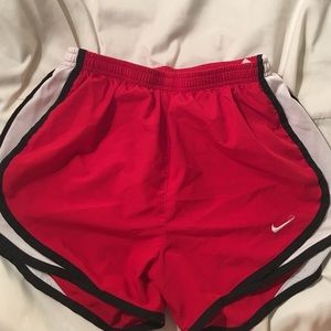 Red Nike running shorts