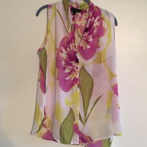 Sheer sleeveless blouse.