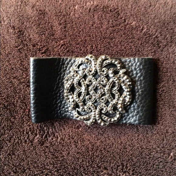 Leather adorned bracelet.