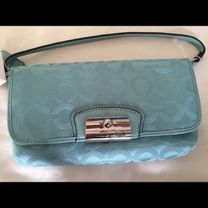 Coach signature clutch with strap
