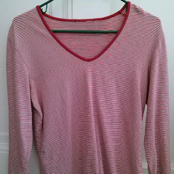 Long sleeve red and white striped shirt.