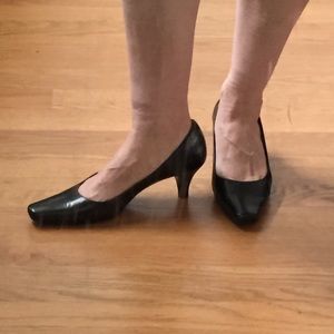Black leather pumps