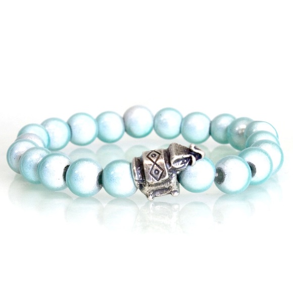 Fiber glass bead bracelet w/metal elephant element