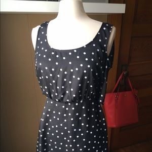 Black and white open back polka dot dress.